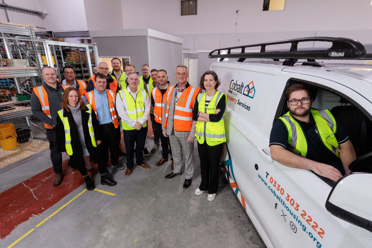 Huws Gray and Cobalt staff pose for a picture at the new store inside Cobalt's warehouse.